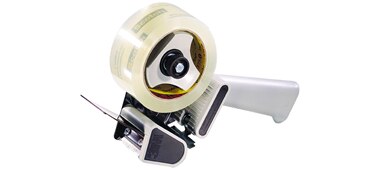 Image of a roll of Scotch® Box Sealing Tape 375 on a 3M hand-held tape dispenser
