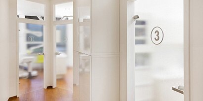 Medical office setting with three doors that have window films.
