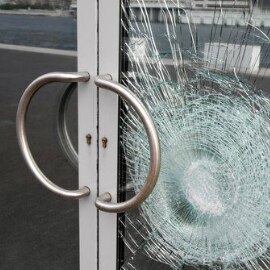 Glass door with shattered glass.
