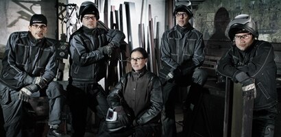 a group of workers with protective gear
