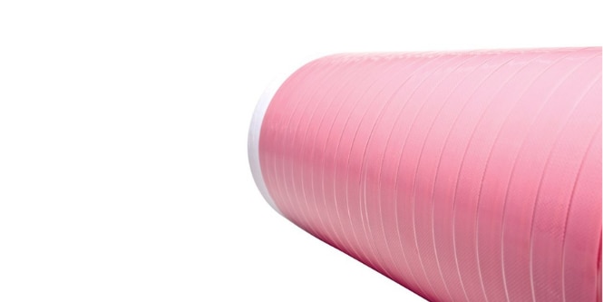 Pink roll of automotive structural adhesive tape

