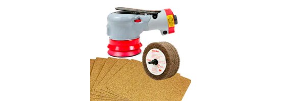 A random orbital sander, and abrasive wheel, and several sheets of sandpaper.
