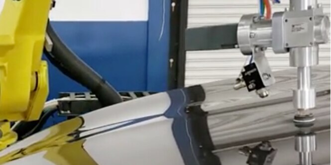 Automated paint defect repair application
