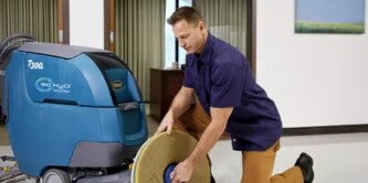 man using 3M floor pad to clean quickly
