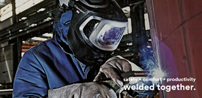 Metal production & fabrication: Man welding wearing PPE

