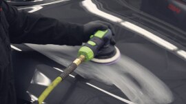 Sander being used on large surface of a car