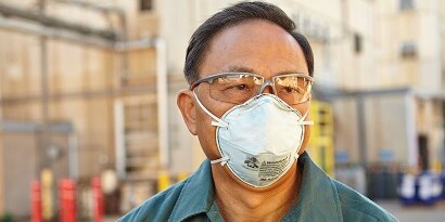 3M Respirator protecting man from nuisance odors
