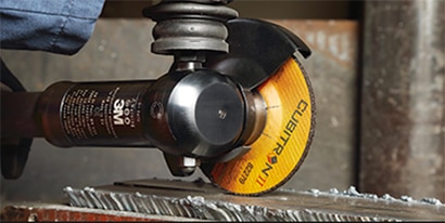 Grind wheel being used to back gouge metal
