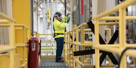 Man using ppe working in a chemical plant
