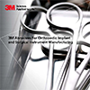 Two surgical scissors on a tray finished with 3M abrasive belts for more control and productivity