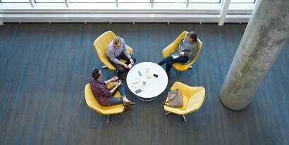 People collaborating at round table
