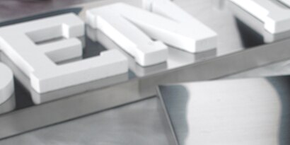 Acrylic letters in a sign to be bonded with plastic adhesive
