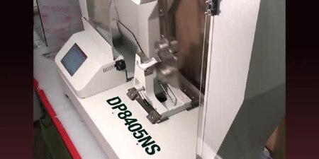 Video still of an impact strength testing machine
