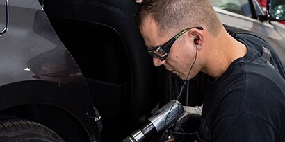 Worker wearing protective entertainment hearing protection

