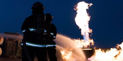 Firefighters in protective gear
