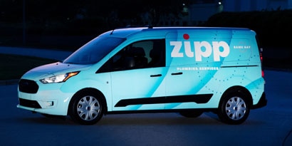 reflective car wrap on a fleet vehicle to give brand visibility during the day and night
