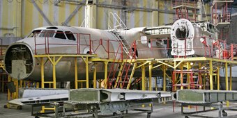 An aircraft under maintenance in the hangar.
