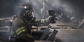 Firefighter wearing hands-free thermal imaging camera facepiece Scott Sight
