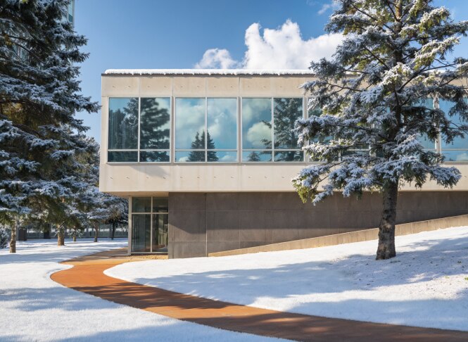 exterior image of windowed building with snow
