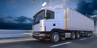 Fleet vehicle truck driving down a highway.
