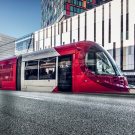 Image of a passenger train passing through a city
