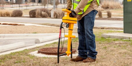 worker looking for underground assets using 3M Locating and Marking equipment
