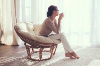 In a bedroom surrounded by windows, the energy efficiency of window films is paired with decorative window treatments for ultimate protection and comfort.
