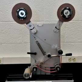 Image of the machine set up to apply two strips of tape simultaneously