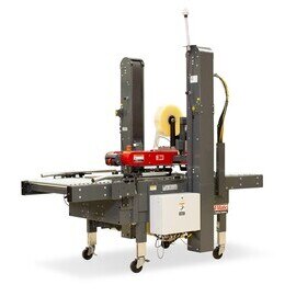 A 3M-Matic industrial case sealer machine with tape rolls, used for automated box packaging.