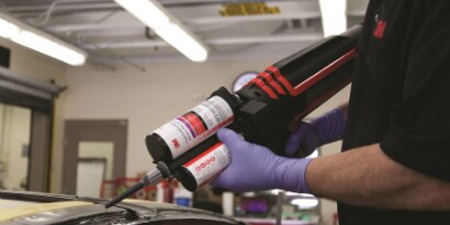 worker applying adhesives
