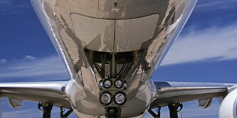 Upshot of the bottom of a plane and it's landing gear.