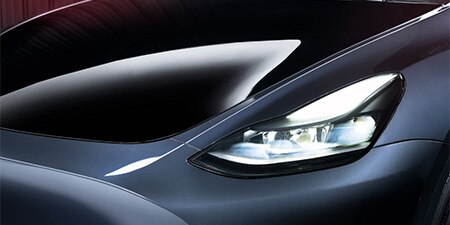 close up of a sleek car hood wrapped in PPF preserving gloss and matte finishes
