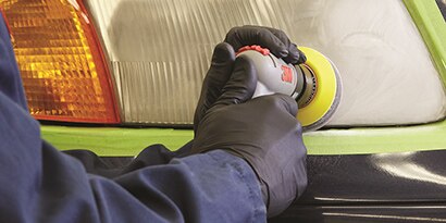 angle sander removing oxidation from large truck headlight lense
