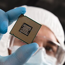 Individual holding a chip.