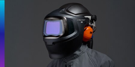 Worker using 3M speedglas 9100mp welding helmet and 3M adflo powered air purifier respirator
