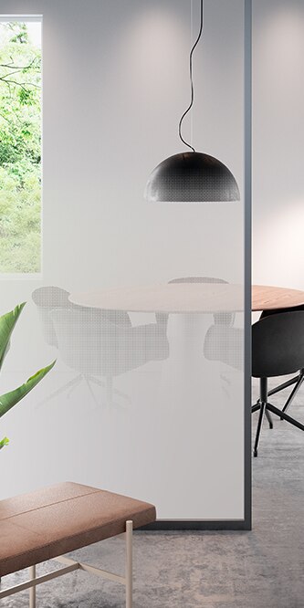 Image of an office showing a conference table obscured by a glass panel covered in FASARA Illumina Seamless-PR
