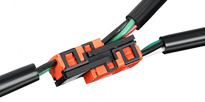 Close-up of 3M Link Connector being connected, highlighting its efficiency in creating branched networks
