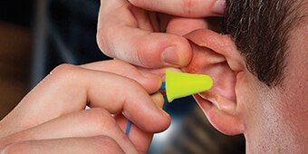 video about fitting push-in style earplugs
