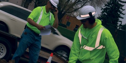 workers on a road construction site

