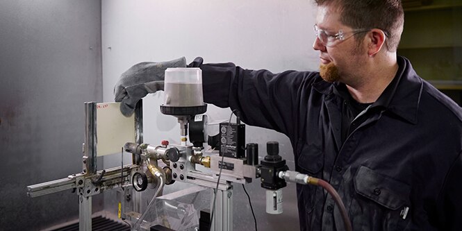 3M technician conducts torch and grit test
