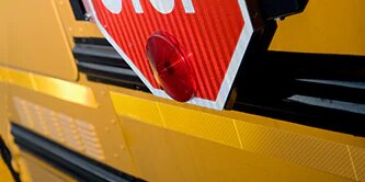School bus stop sign with conspicuity

