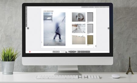 Desktop computer showing image of interactive catalog.
