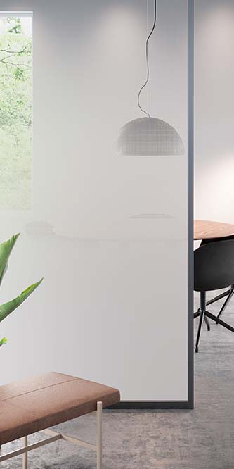 Image of an office showing a conference table obscured by a glass panel covered in FASARA Illumina PR
