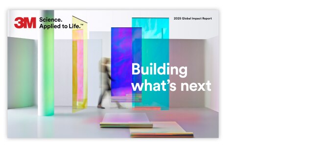 A person walks through a modern, abstract space featuring large, colorful translucent panels.
