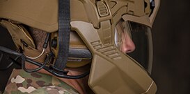 close up of protective comms under special forces helmet
