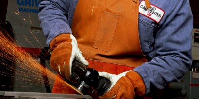 3M™ Cubitron™ II Flexible Grinding Wheel on 3M™ Grinder being used by an Operator to grind with Sparks
