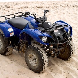 Image of an all-terrain vehicle in a sandy location