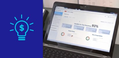 Icon of light bulb and dollar sign with image of data on computer screen