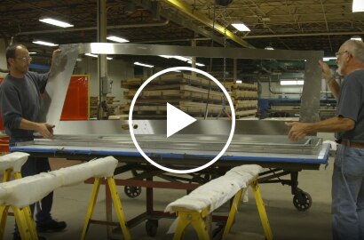 Still shot from a video talking about Dawson Doors eliminating production steps by switching to a 3M structural adhesive