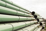Stacks of coated pipe